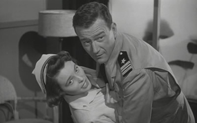 Patricia Neal and John Wayne in Operation Pacific