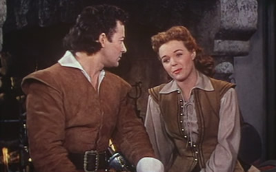 Cornel Wilde and Nancy Gates in Sons of the Musketeers (1952) Cornel Wilde and Nancy Gates in Sons of the Musketeers (1952)